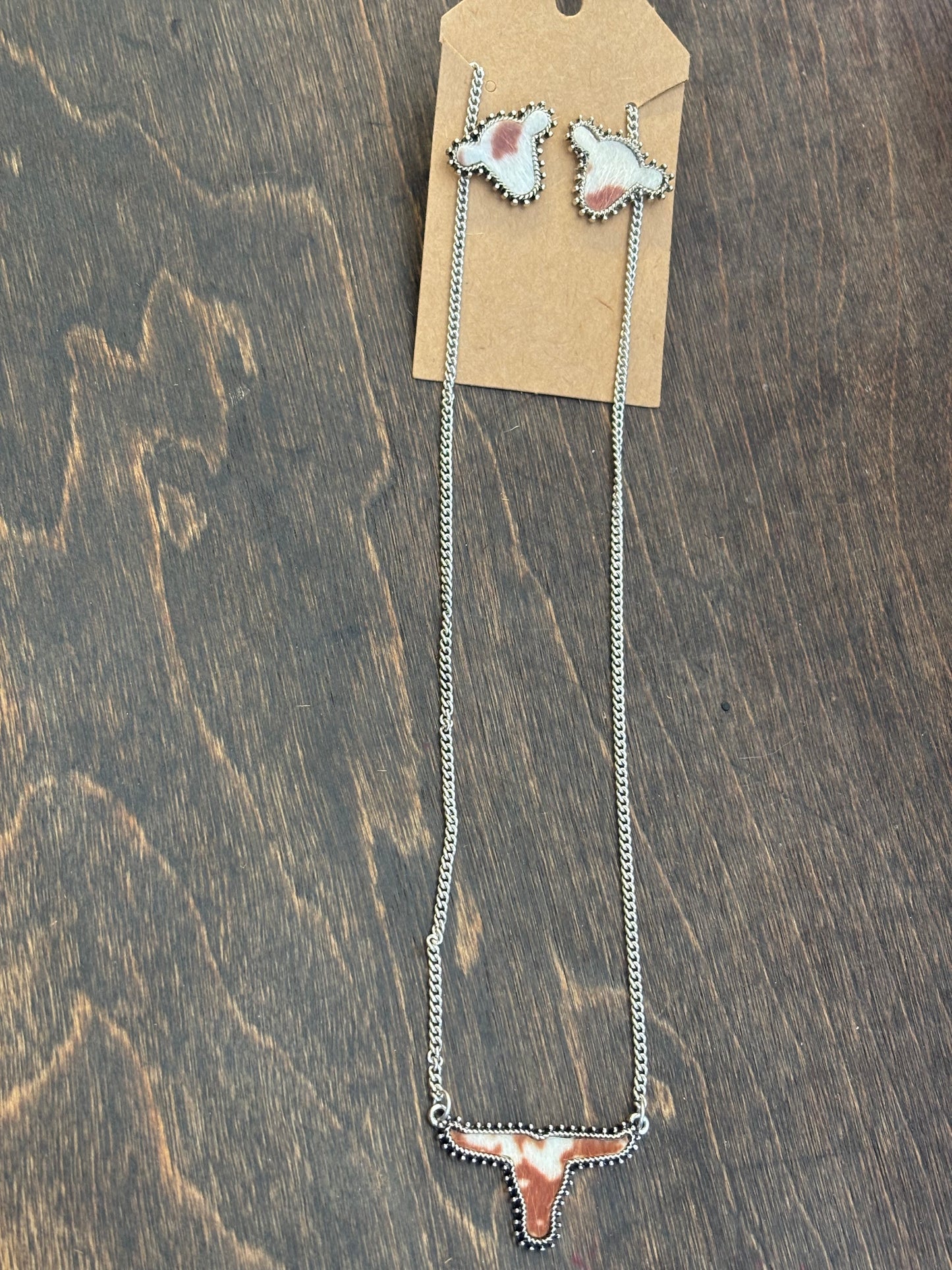 brown and white cow head necklace and earring set